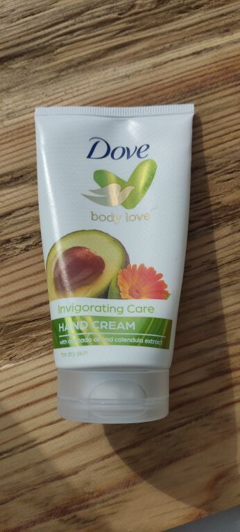 Крем для рук з олією авокадо і екстрактом календули Dove Nourishing Secrets Invigorating Ritual Hand