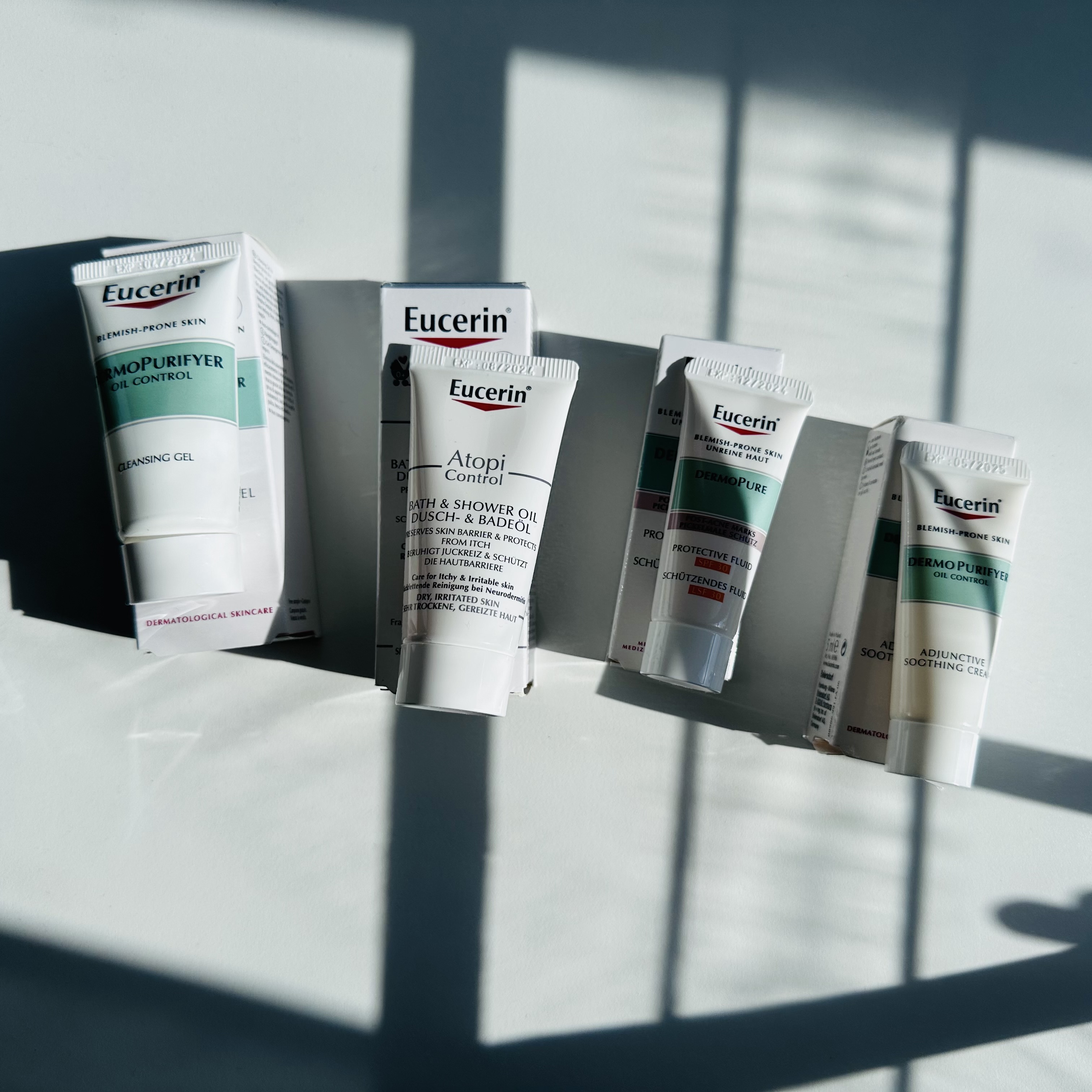 Серія Eucerin DermoPure (крем, гель для вмивання, SPF 30) та олія AtopiControl